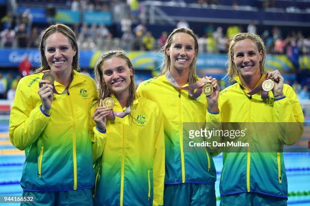 Gold medalists Emily Seebohm, Georgia Bohl, Emma McKeon and Bronte Campbell of Australia pose during the medal ceremony for the Women's 4 x 100m...
