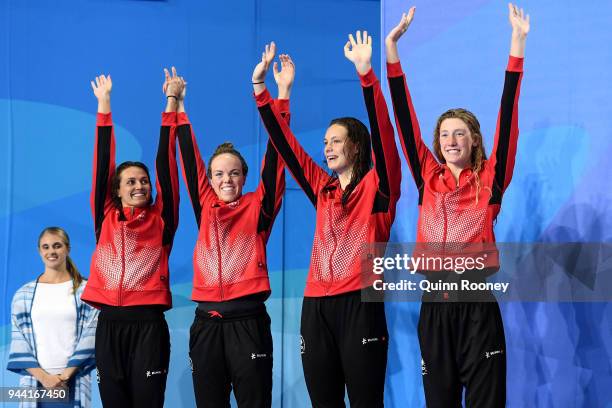 Silver medalists Kylie Masse, Kierra Smith, Penny Oleksiak and Taylor Ruck of Canada pose during the medal ceremony for the Women's 4 x 100m Medley...