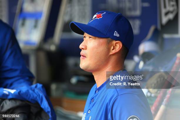 Seung Hwan Oh of the Toronto Blue Jays looks on from the dugout in the eighth inning against the Texas Rangers at Globe Life Park in Arlington on...