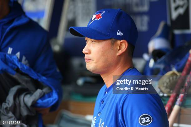 Seung Hwan Oh of the Toronto Blue Jays looks on from the dugout in the eighth inning against the Texas Rangers at Globe Life Park in Arlington on...