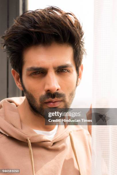 Bollwood actor Kartik Aaryan poses during the promotion of Sonu Ke Titu Ki Sweety on February 13, 2018 in New Delhi, India.