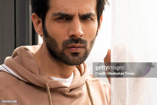 Bollwood actor Kartik Aaryan poses during the promotion of Sonu Ke Titu Ki Sweety on February 13, 2018 in New Delhi, India.