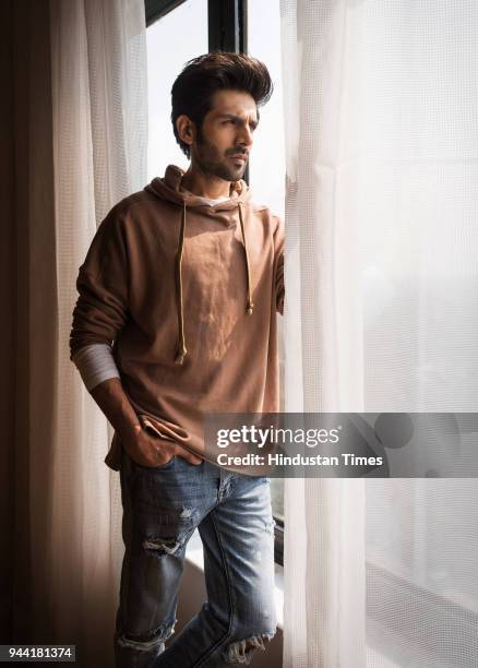 Bollwood actor Kartik Aaryan poses during the promotion of Sonu Ke Titu Ki Sweety on February 13, 2018 in New Delhi, India.