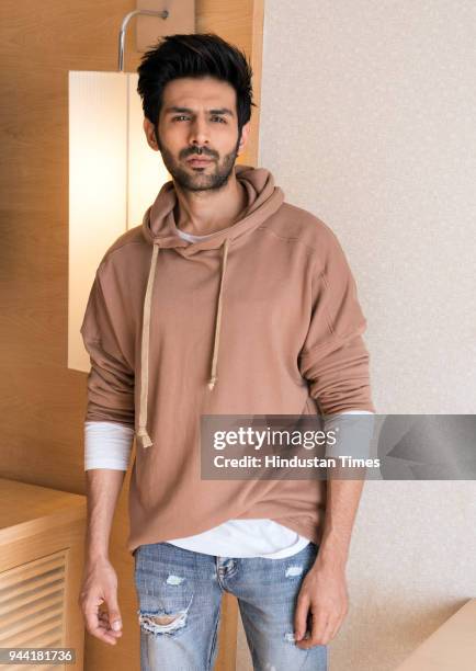 Bollwood actor Kartik Aaryan poses during the promotion of Sonu Ke Titu Ki Sweety on February 13, 2018 in New Delhi, India.