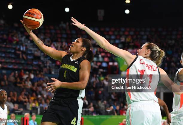 Tarita Gordon of Jamaica attempts a lay up past Mollie Campbell of England during the womens Qualifying Final between England and Jamaica on day six...