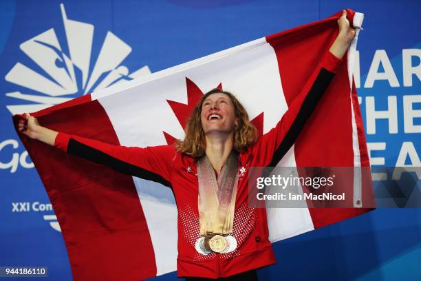 Taylor Ruck of Canada poses with the eight medals she won in the pool on day six of the Gold Coast 2018 Commonwealth Games at Optus Aquatic Centre on...