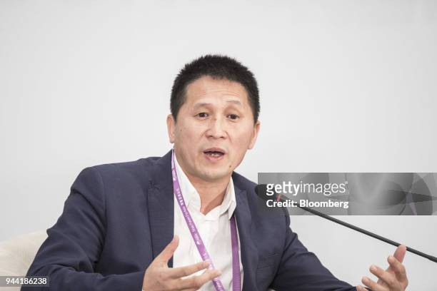 Li Jianhua, chief development officer of Didi Chuxing, gestures as he speaks during a session at the Boao Forum for Asia Annual Conference in Boao,...