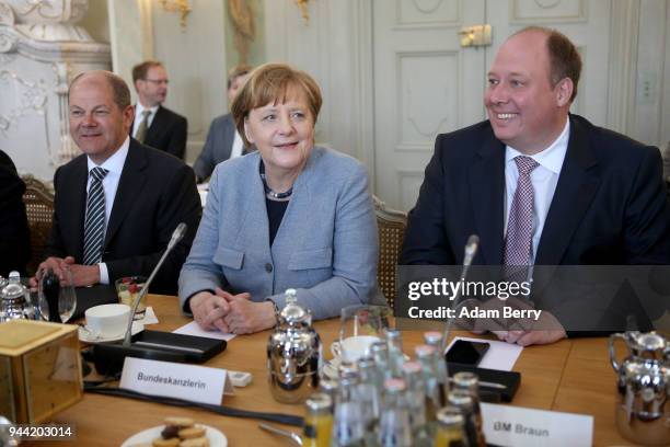 Finance Minister and Vice Chancellor Olaf Scholz , German Federal Chancellor Angela Merkel , and Chancellery Minister Helge Braun attend a government...
