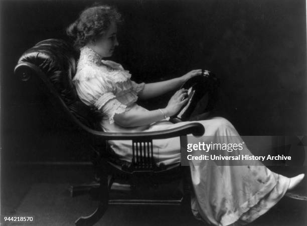 Helen Keller holding vase in her hand and touching it. Helen Keller , American author, political activist, and lecturer. She was the first deaf-blind...
