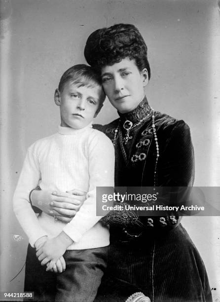 Maud Queen of Norway with her son Prince Olav. Maud was Queen of Norway, as spouse of King Haakon VII. Olav V was King of Norway from 1957 until his...