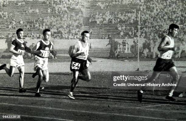 Photograph of Janusz Kusocinski running in the 10000 Meter race during the 1932 Olympic games. Kusocinski won against the Finns Volmari Iso-Hollo and...