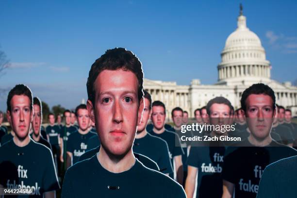 Life-sized cutouts of Facebook CEO Mark Zuckerberg sit on the lawn of the U.S. Capitol on April 10, 2018 in Washington, DC. The advocacy group Avaaz...