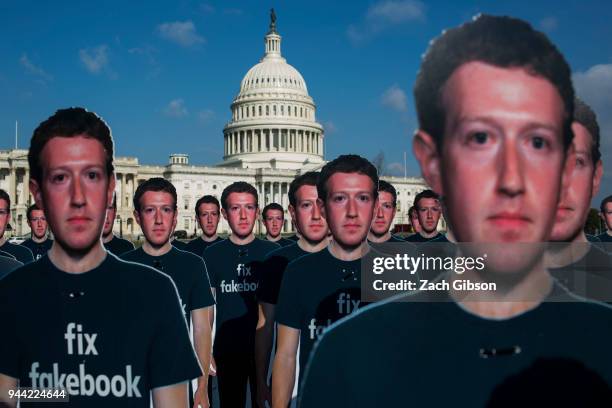 Life-sized cutouts of Facebook CEO Mark Zuckerberg sit on the lawn of the U.S. Capitol on April 10, 2018 in Washington, DC. The advocacy group Avaaz...