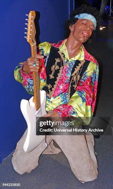 Waxwork statue of Jimi Hendrix , an American rock guitarist, singer, and songwriter.