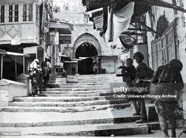 Israeli soldiers advance through East Jerusalem, during the 1967 Six Day War.