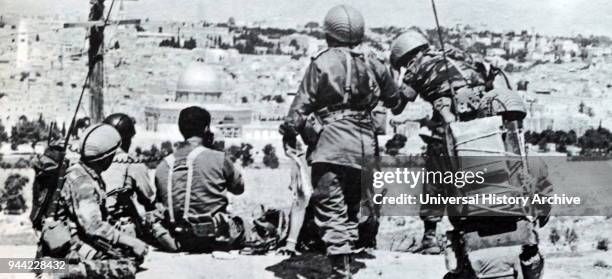 Israeli soldiers observe the old city of Jerusalem as they advance towards East Jerusalem in the 1967, Six Day war.