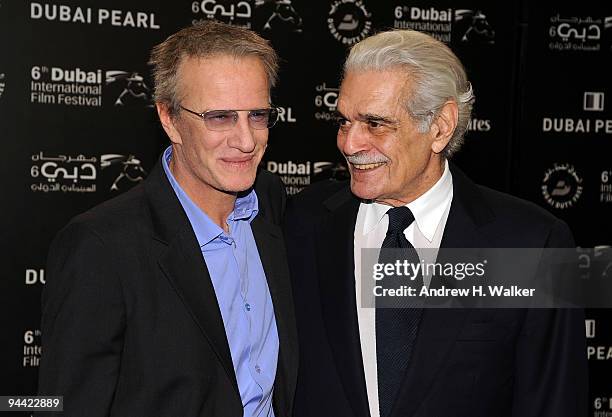 Actors Christopher Lambert and Omar Sharif attend the "Cartagena" premiere during day six of the 6th Annual Dubai International Film Festival held at...