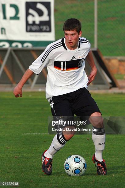 Denis Russ of Germany runs with the ball during an Under-18 international friendly match on December 14, 2009 in Kfar Saba, Israel. Germany, Hungary,...