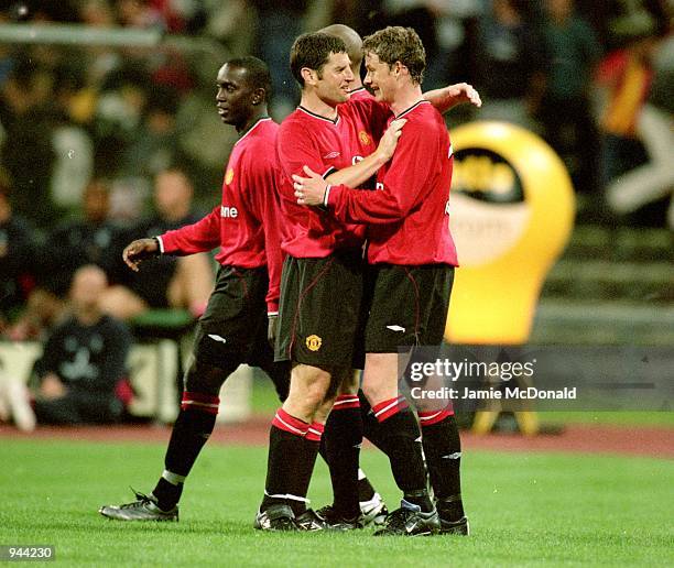 Dennis Irwin and Ole Gunnar Solskjaer of Manchester United celebrate during the Pre season friendly tournament against Bayern Munich at the Olympic...