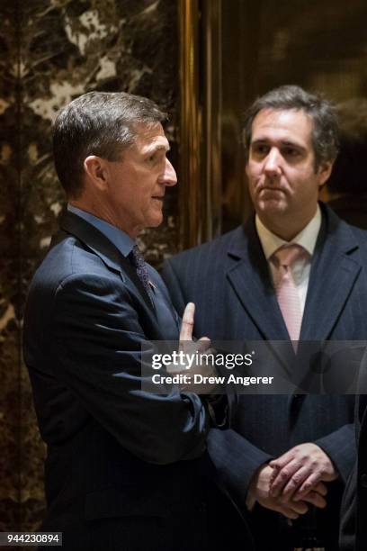 Retired Lt. Gen. Michael Flynn, President-elect Donald Trump's choice for National Security Advisor, talks with Michael Cohen, personal lawyer for...