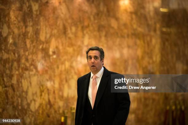 Michael Cohen, personal lawyer for President-elect Donald Trump, walks through the lobby at Trump Tower, January 12, 2017 in New York City. Trump and...