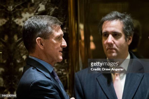 Retired Lt. Gen. Michael Flynn, President-elect Donald Trump's choice for National Security Advisor, talks with Michael Cohen, personal lawyer for...