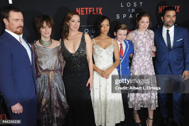 Cast Toby Stephens, Molly Parker, Parker Posey, Taylor Russell, Maxwell Jenkins, and Mina Sundwall arrive for the Premiere Of Netflix's "Lost In...