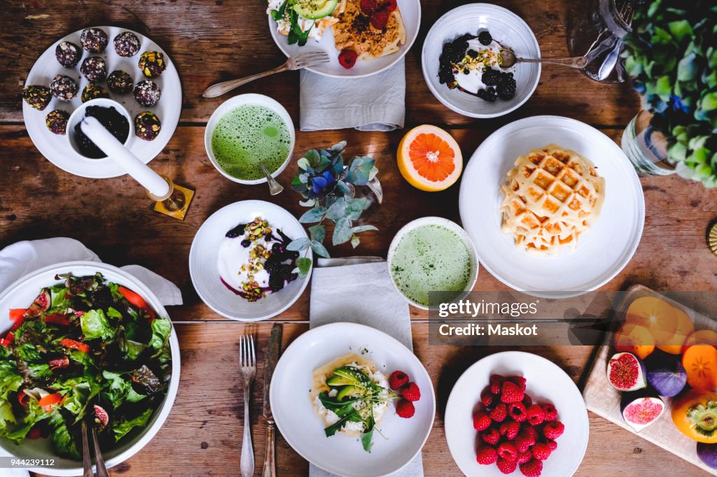 Directly above shot of various food on wooden table