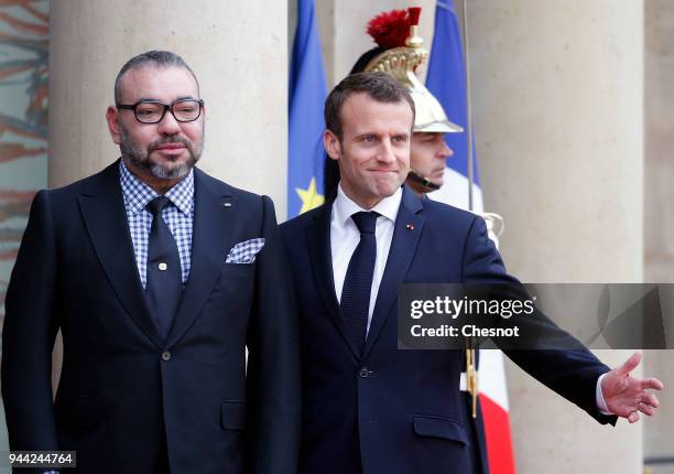 French President Emmanuel Macron welcomes Morocco's King Mohammed VI prior to their meeting at the Elysee Presidential Palace on April 10, 2018 in...