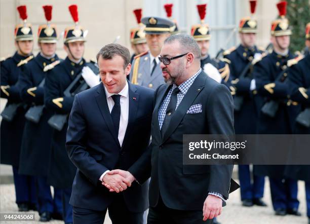 French President Emmanuel Macron welcomes Morocco's King Mohammed VI prior to their meeting at the Elysee Presidential Palace on April 10, 2018 in...