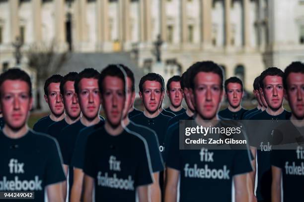 Life-sized cutouts of Facebook CEO Mark Zuckerberg sit on the lawn of the U.S. Capitol on April 10, 2018 in Washington, DC. The advocacy group Avaaz...