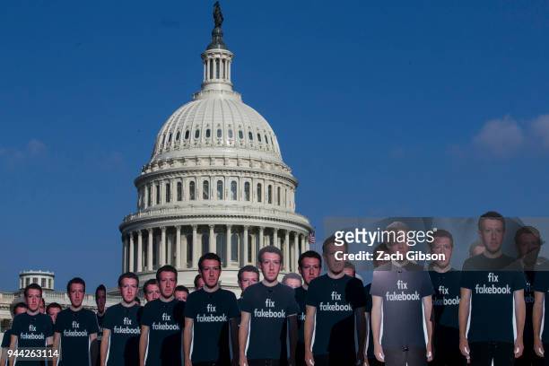 Life-sized cutouts of Facebook CEO Mark Zuckerberg sit on the lawn of the U.S. Capitol on April 10, 2018 in Washington, DC. The advocacy group Avaaz...