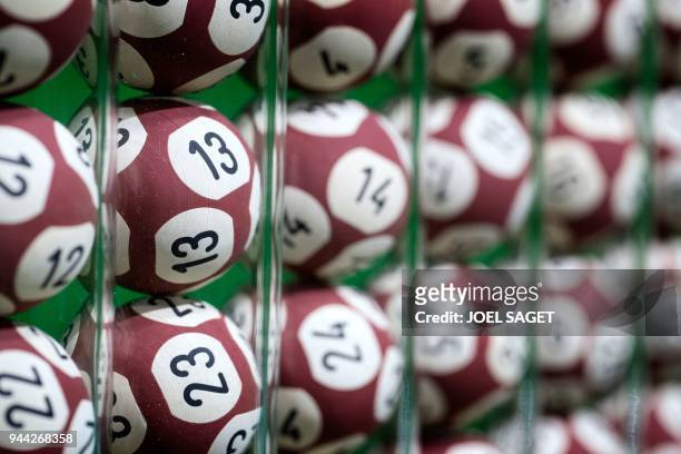 Picture taken on April 9, 2018 shows lottery balls for the Euromillion lottery on the set of the "Francaise des Jeux" FDJ in Boulogne Billancourt.