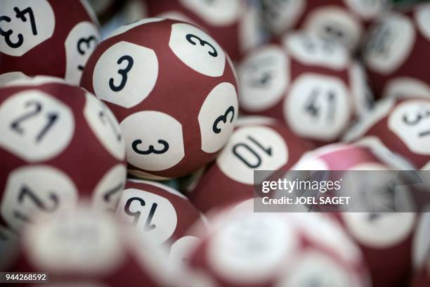 Picture taken on April 9, 2018 shows lottery balls for the Euromillion lottery on the set of the "Francaise des Jeux" FDJ in Boulogne Billancourt.