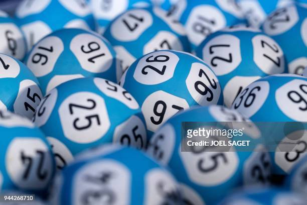 Picture taken on April 9, 2018 shows lottery balls for the Loto lottery on the set of the "Francaise des Jeux" FDJ in Boulogne Billancourt.