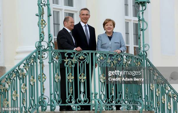 Finance Minister and Vice Chancellor Olaf Scholz , NATO Secretary-General Jens Stoltenberg, and German Federal Chancellor Angela Merkel arrive for a...