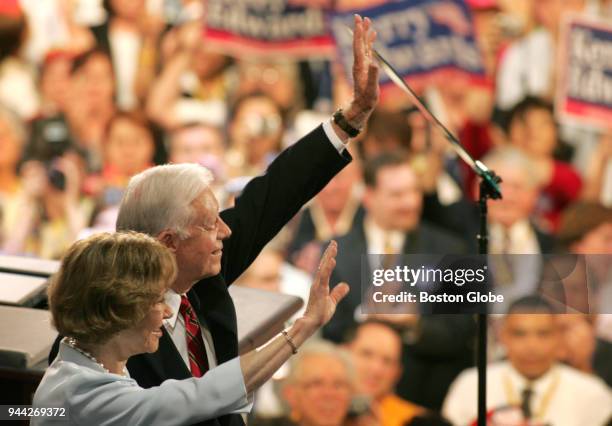 Former President Jimmy Carter and his wife, Rosalynn Carter, wave to delegates at the Democratic National Convention at the FleetCenter in Boston on...