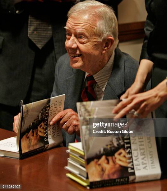 Former President Jimmy Carter sign his controversial book on Palestine at the Harvard Coop in Cambridge, Mass., on Jan. 23, 2007.