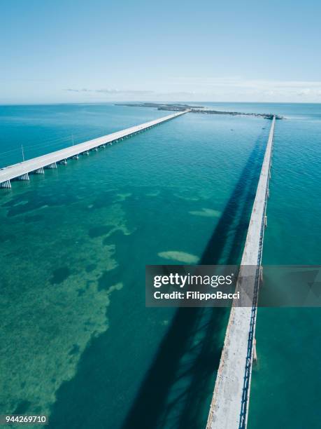 bridge in florida keys from drone point of view - bahia honda key stock pictures, royalty-free photos & images