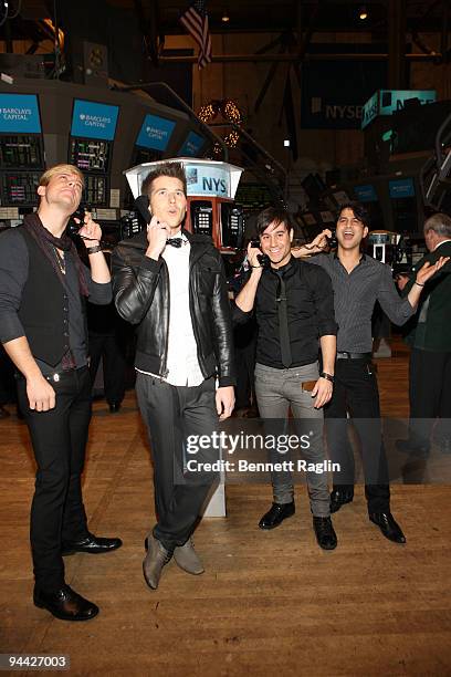 Andrew Lee, Alexander Noyes, Michael Bruno, and Jason Rosen of Honor Society stand on the floor at the New York Stock Exchange on December 14, 2009...