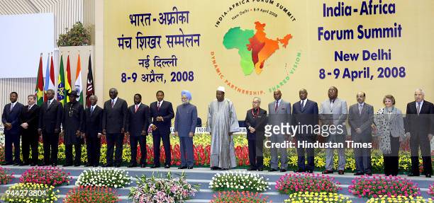 Prime Minister Manmohan Singh and African Union Chairman Prof Alpha Oumarkonare pose for a group photo with other dignitaries at the inaugural...