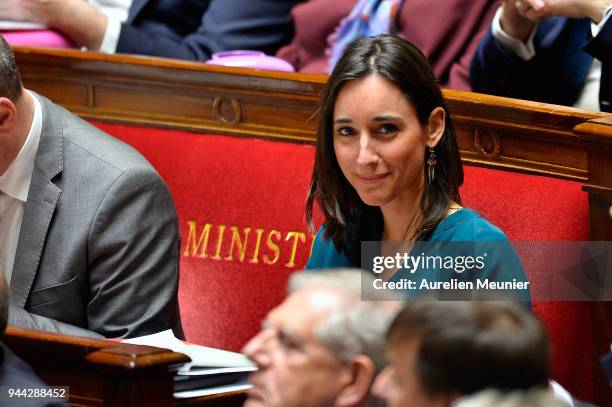 Junior Minister Brune Poirson reacts as Ministers answer deputies during the weekly session of questions to the government at Assemblee Nationale on...