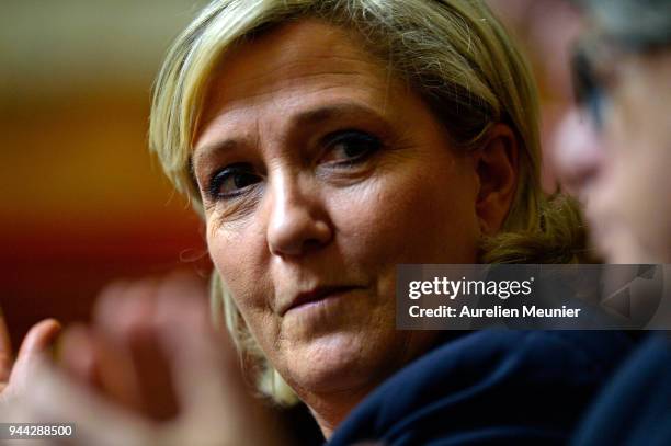 Front National President Marine Le Pen reacts as Ministers answer deputies during the weekly session of questions to the government at Assemblee...