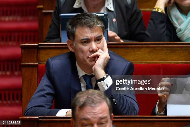 Newly appointed First Secretary of the French Socialist Party Olivier Faure reacts as Ministers answer deputies during the weekly session of...
