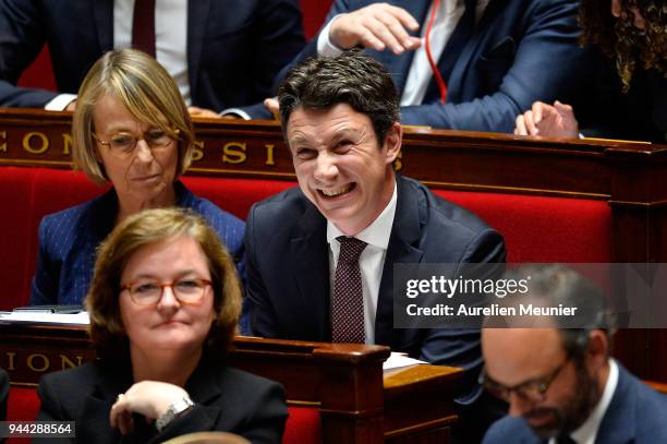 Secretary of State to the Prime Minister and Government Spokesman Benjamin Griveaux reacts as Ministers answer deputies during the weekly session of...