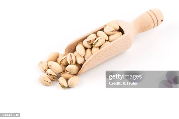 pistachio nut close up - crack spoon stock pictures, royalty-free photos & images