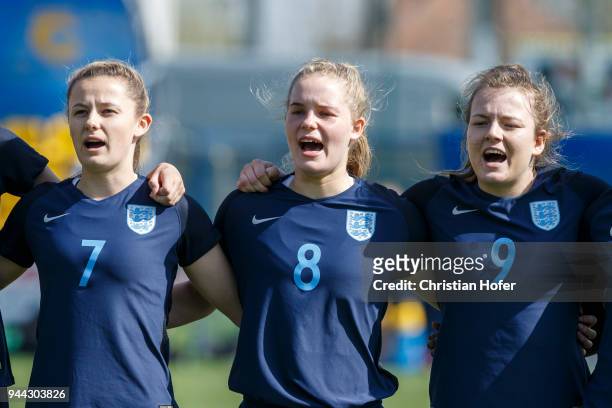 Hannah Cain, Constance Schofield and Lauren Hemp of England line up during the national anthem prior to the UEFA Women's Under19 Elite Round match...