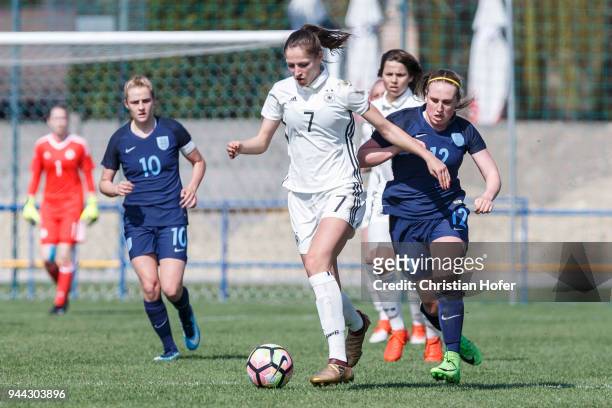Melissa Koessler of Germany challenges Rebecca Rayner of England for the ball during the UEFA Women's Under19 Elite Round match between England and...