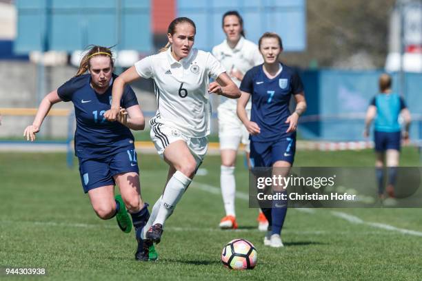 Rebecca Rayner of England challenges Sydney Lohmann of Germany for the ball during the UEFA Women's Under19 Elite Round match between England and...