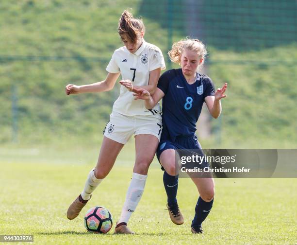 Melissa Koessler of Germany challenges Constance Schofield of England for the ball during the UEFA Women's Under19 Elite Round match between England...